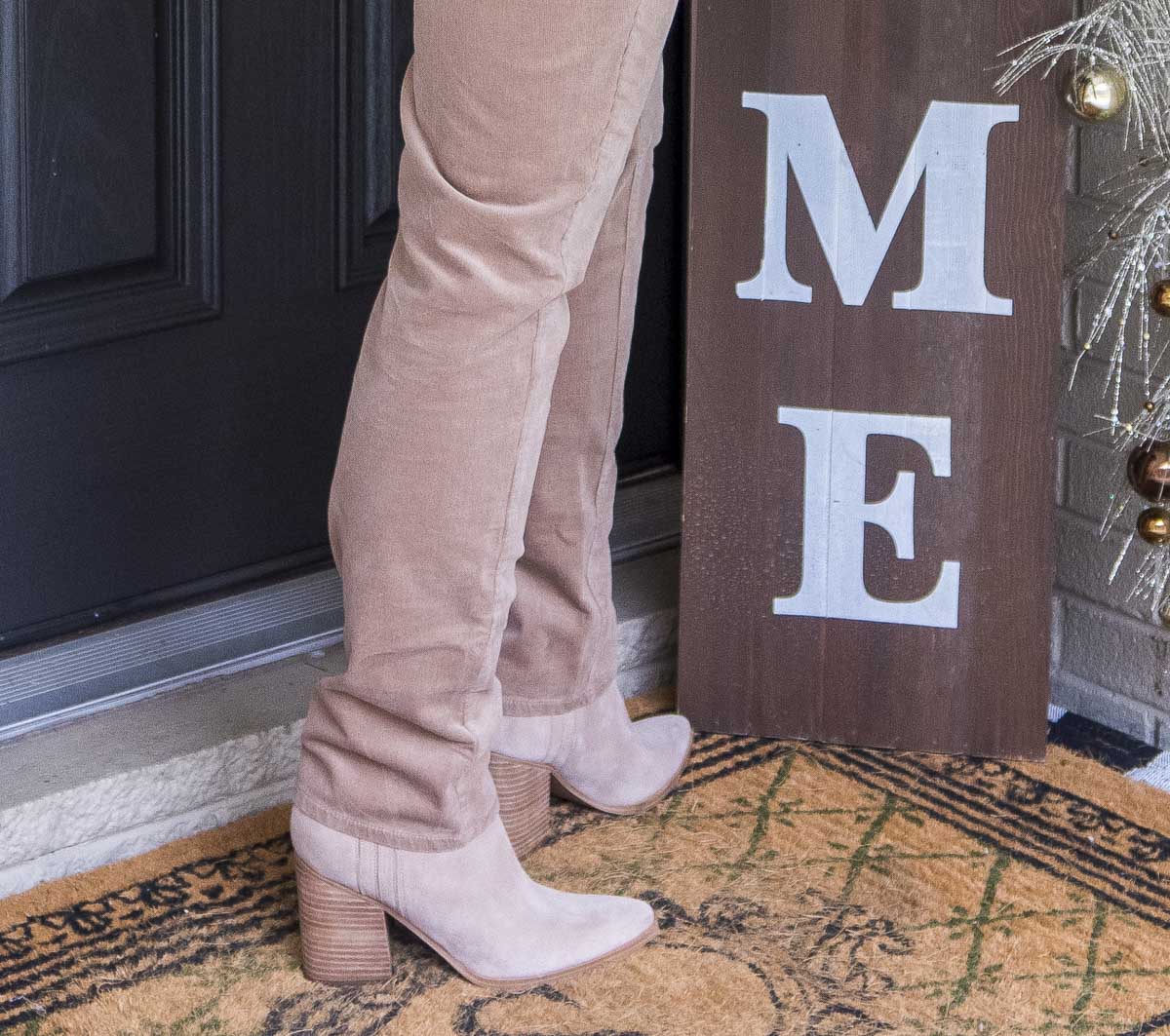 Fashion Blogger 50 Is Not Old is wearing taupe corduroy pants with chunky heel boots