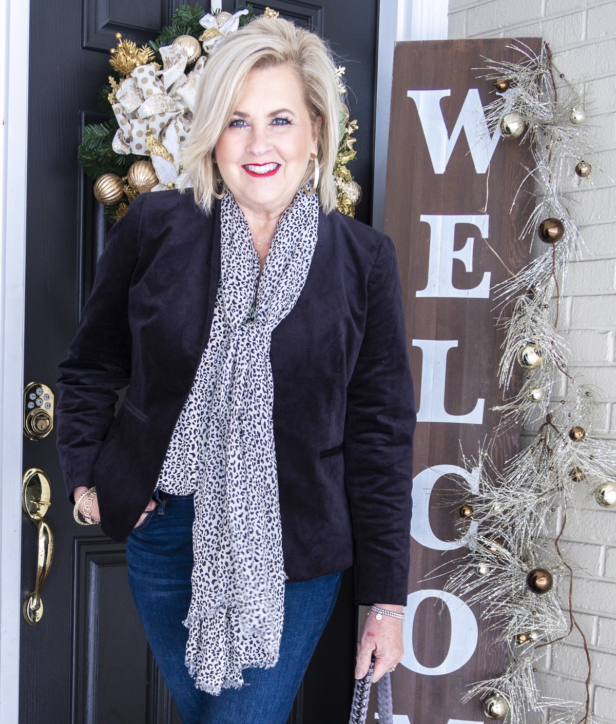 Fashion Blogger 50 Is Not Old is wearing a cheetah print camisole and matching scarf with a black velvet jacket