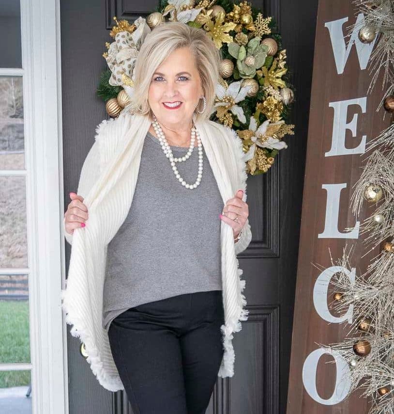 Fashion Blogger 50 Is Not Old is wearing a gray tank with an Ecru colored cocoon cardigan with a large collar