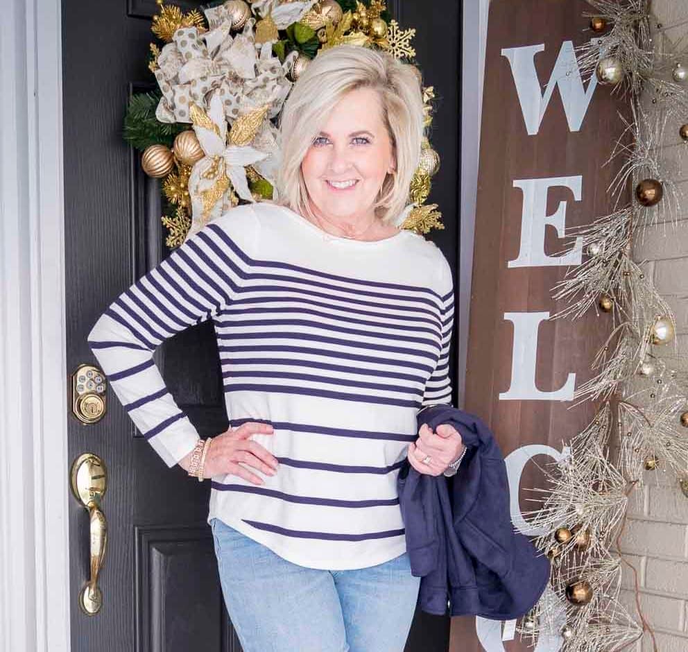 Fashion Blogger 50 Is Not Old is wearing a striped sweater