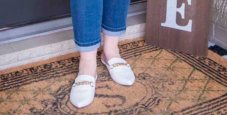 Fashion Blogger 50 Is Not Old is wearing bone chain link mules
