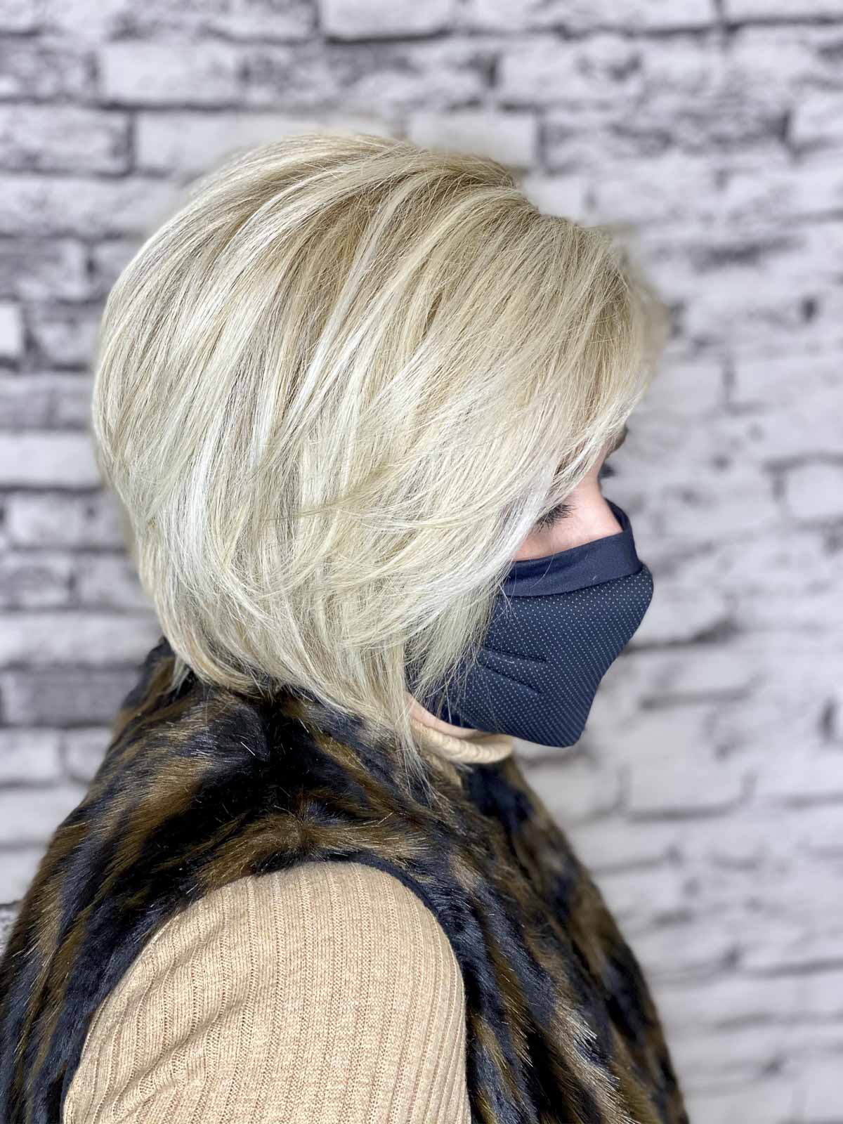 Fashion Blogger 50 Is Not Old is showing the side view of a new haircut