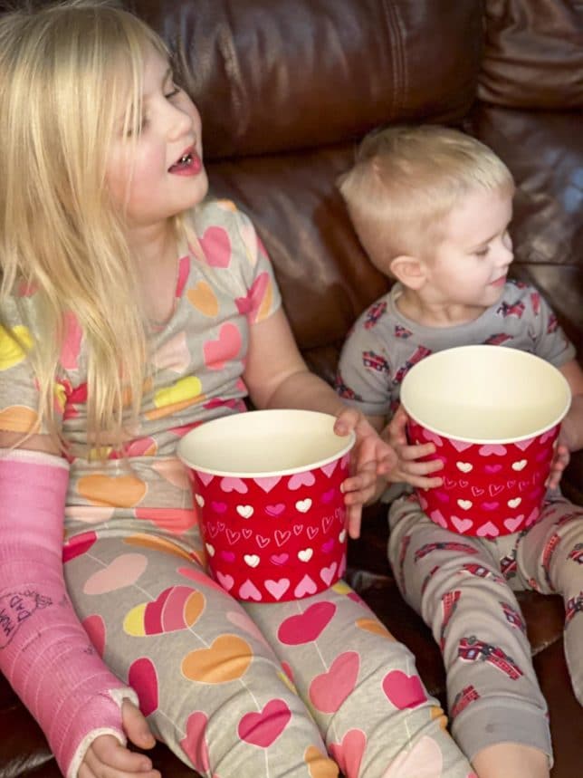 Fashion Blogger 50 Is Not Old's grandchildren in their PJ's with red buckets