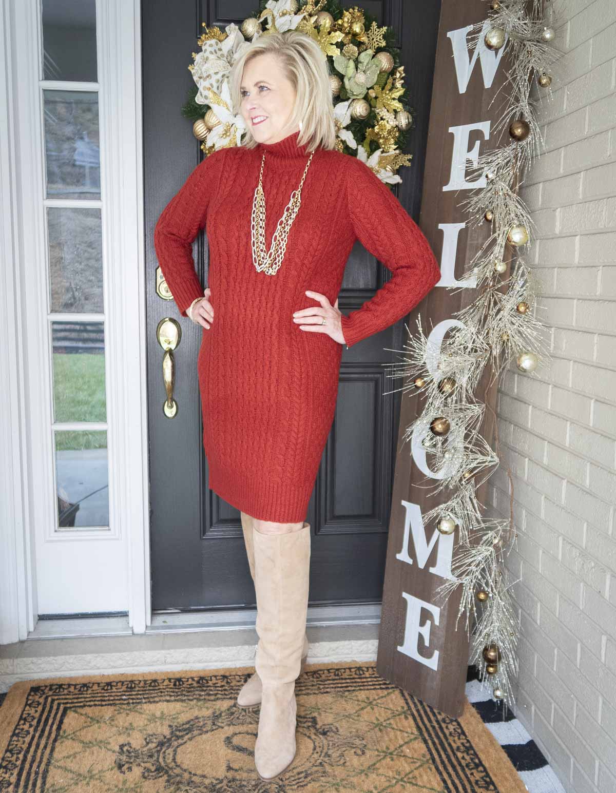 Fashion Blogger 50 Is Not Old is looking her best in this red sweater dress from Ann Taylor, and tall knee boots