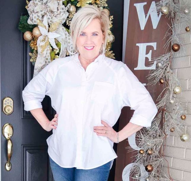 ashion Blogger 50 Is Not Old is wearing a classic white button up shirt with silver jewelry