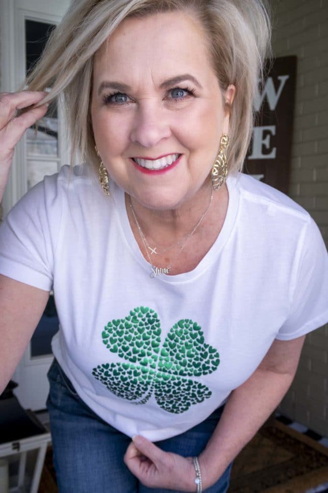 Fashion Blogger 50 Is Not Old is wearing a metallic 4 leaf clover tee shirt