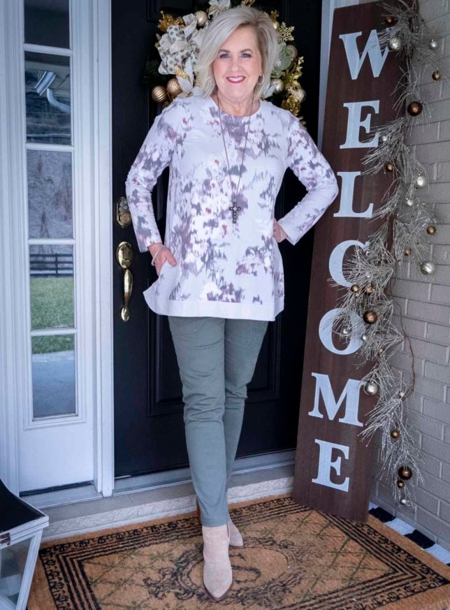 Fashion Blogger 50 Is Not Old is wearing a tie-dye sweatshirt tunic top from J. Jill with a pair of cargo pants and neutral colored ankle boots