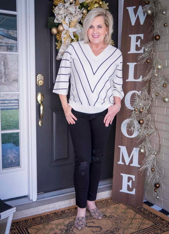 Fashion Blogger 50 Is Not Old is wearing a chevron striped top and distressed black jeans