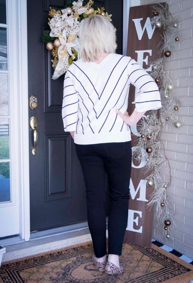 Fashion Blogger 50 Is Not Old is looking thin in this chevron striped top and black jeans