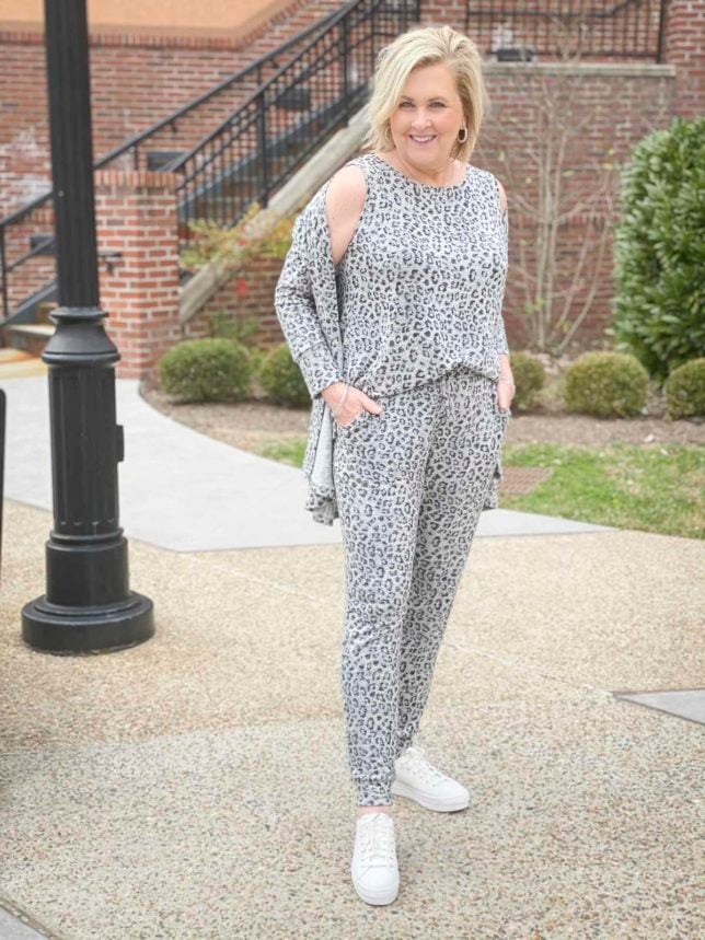 Fashion Blogger 50 Is Not Old is wearing an animal print tank, jogger, and cardigan luxe loungewear set from Chico's and Ked's platform sneakers