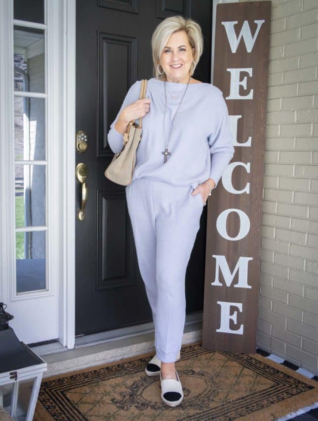 Fashion Blogger 50 Is Not Old is wearing a light blue sweater set with espadrille shoes