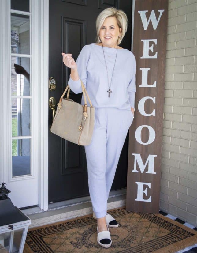 Fashion Blogger 50 Is Not Old is wearing a light blue loungewear sweater set with two-tone espadrille shoes