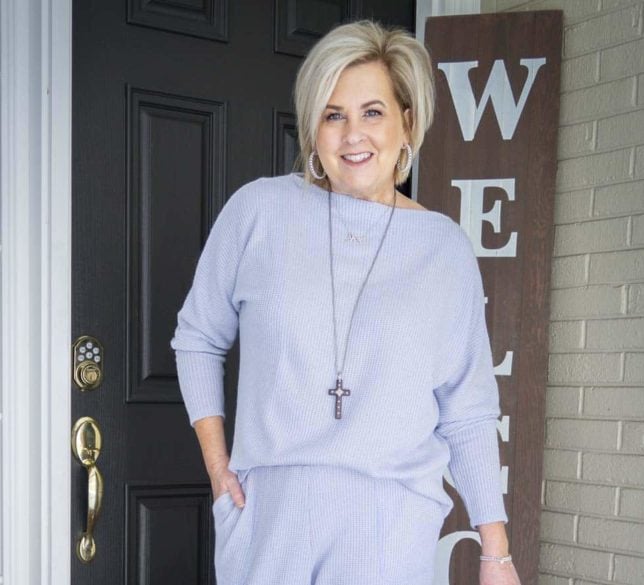 Fashion Blogger 50 Is Not Old is wearing a blue loungewear sweater set with a cross necklace