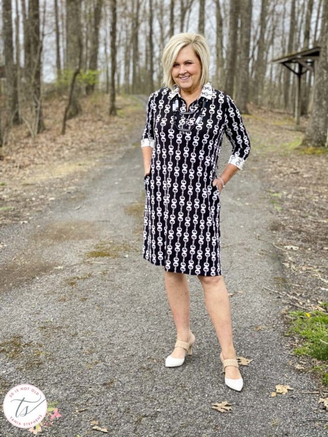 Fashion Blogger 50 Is Not Old is wearing a classic black and white color combination in a bit and bridle dress by Chicos