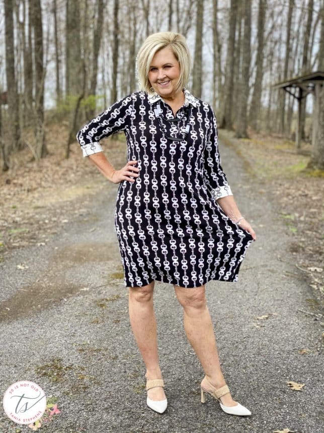 Fashion Blogger 50 Is Not Old is wearing a black and white bit and bridle dress with Rockport heels