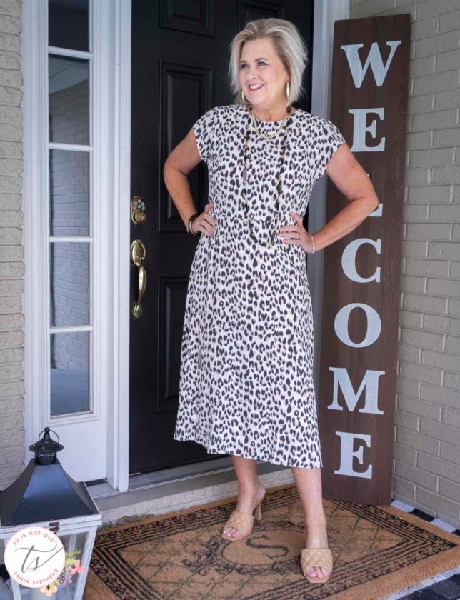 Fashion Blogger 50 Is Not Old is wearing feminine and flirty in a leopard print dress and quilted leather heels
