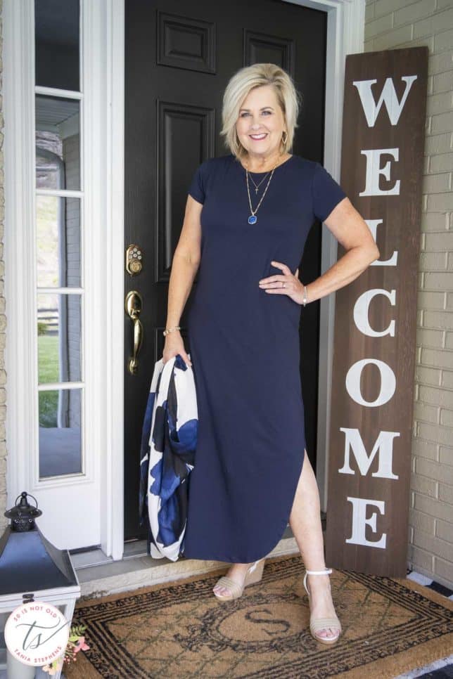 Fashion Blogger 50 Is Not Old is wearing a navy t-shirt dress with gold jewelry