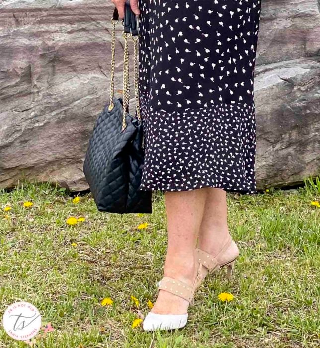 Fashion Blogger 50 Is Not Old is wearing a pair of beige and white heels