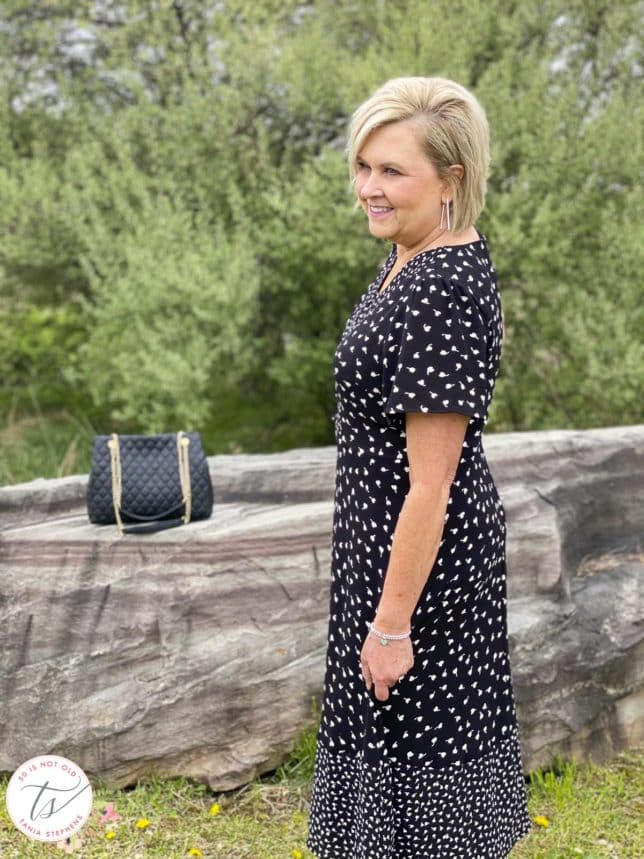 Fashion Blogger 50 Is Not Old is wearing a black and white print dress from Talbots