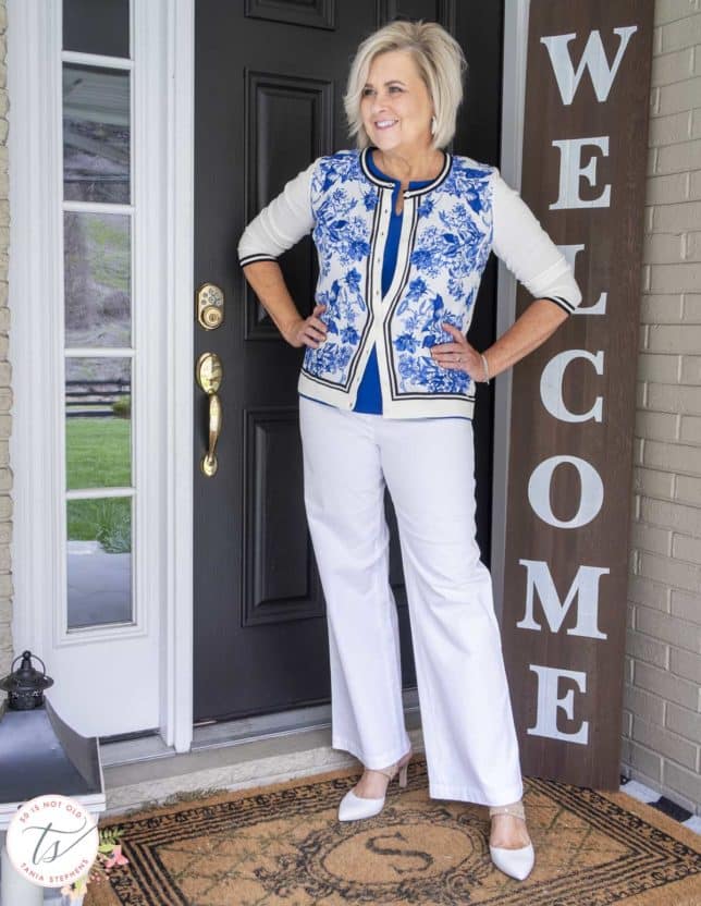 Fashion Blogger 50 Is Not Old is looking sharp in a blue and white toile cardigan and white wide leg pants