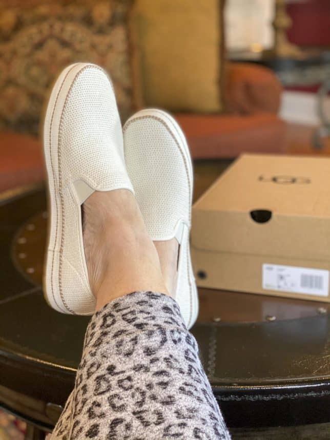 Fashion Blogger 50 Is Not Old is wearing a pair of UGG Bren white sneakers with brown stripes for summer
