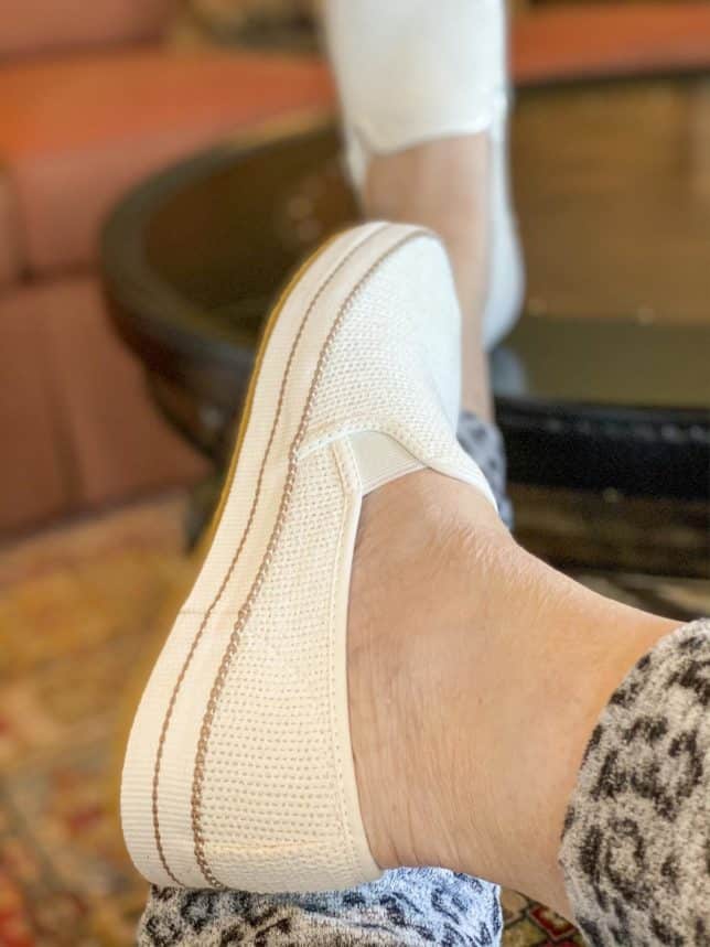 Fashion Blogger 50 Is Not Old is wearing a pair of UGG Bren white sneakers with brown stripes