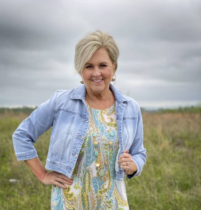 Fashion Blogger 50 Is Not Old is wearing a cropped denim jacket