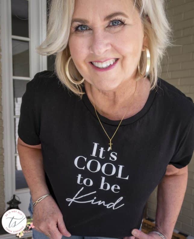 Fashion Blogger 50 Is Not Old is wearing a black and white graphic tee