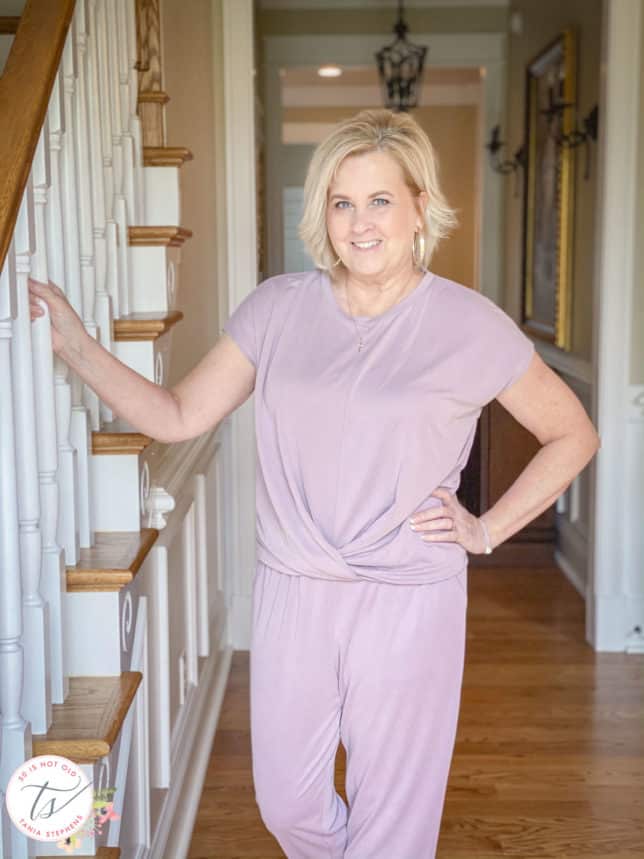 Fashion Blogger 50 Is Not Old is wearing a front twist top in light grape