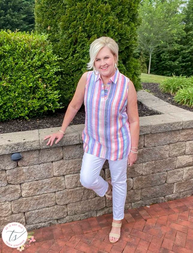 Fashion Blogger 50 Is Not Old is wearing a 100% linen striped tunic top and white straight leg jeans