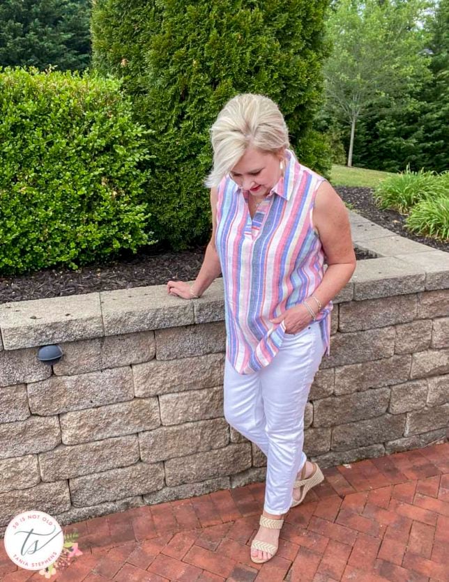 Fashion Blogger 50 Is Not Old is keeping cool this Memorial Day in a 100% linen striped tunic top and white straight leg jeans
