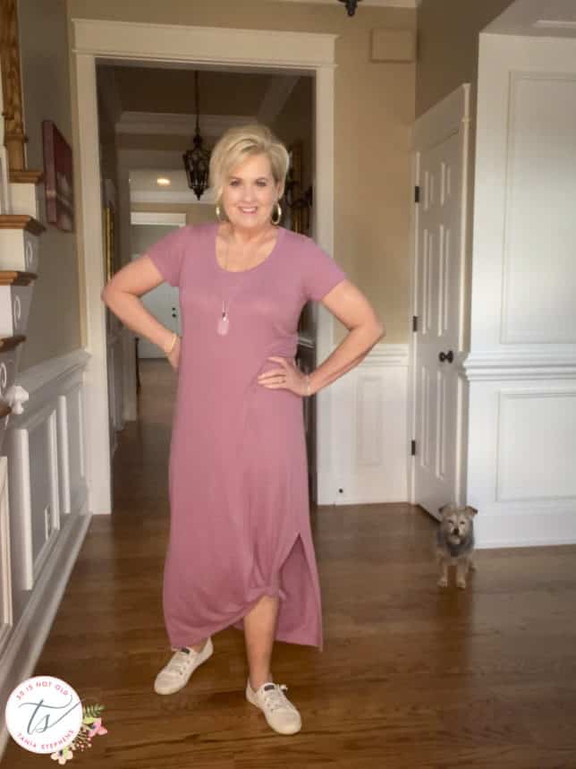 Fashion Blogger 50 Is Not Old is wearing a dusty rose long maxi dress that is tied up on one side