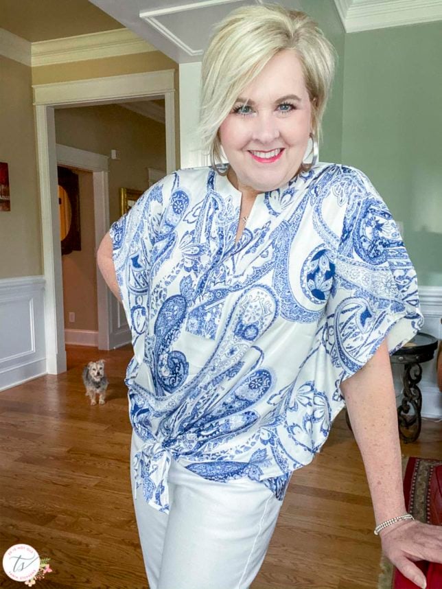 Fashion Blogger 50 Is Not Old is wearing a navy and white paisley tie-front top
