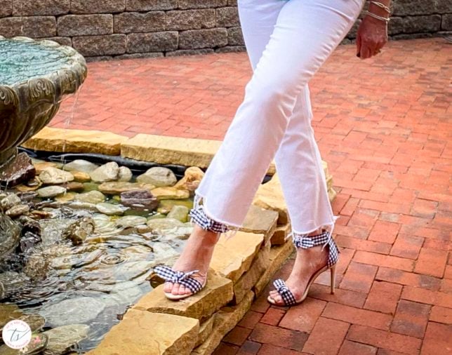 Fashion Blogger 50 Is Not Old is wearing white crop jeans and navy and white gingham heels