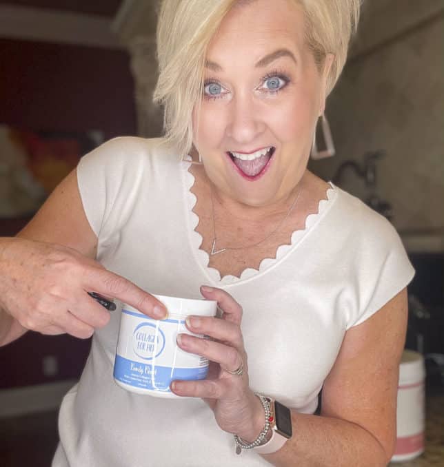 Fashion Blogger 50 Is Not Old is showing the Marine Collagen Beauty Blend supplement that she puts in her afternoon tea