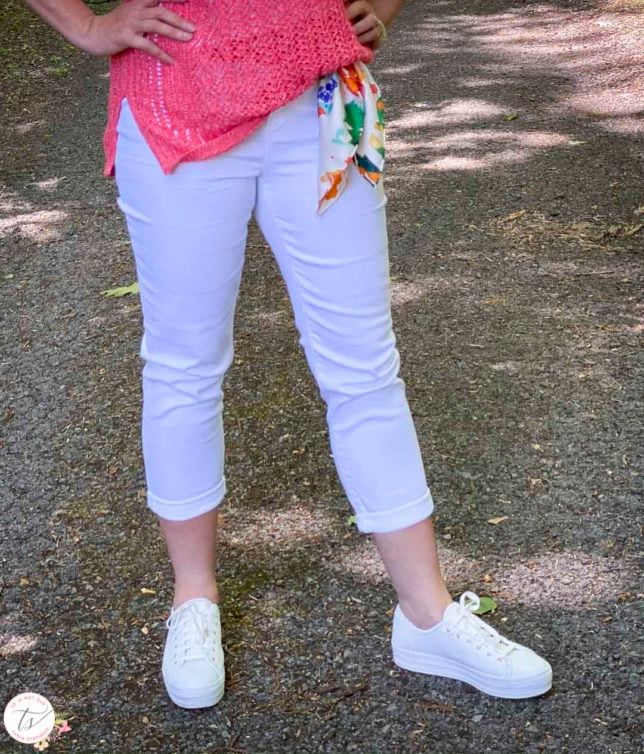Fashion Blogger 50 Is Not Old is wearing white crop jeans with a scarf for a belt, and Keds sneakers