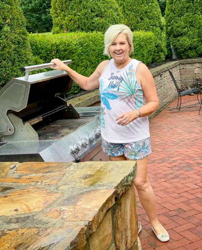 Fashion Blogger 50 Is Not Old is checking the grill while wearing pajamas from Vera Bradley