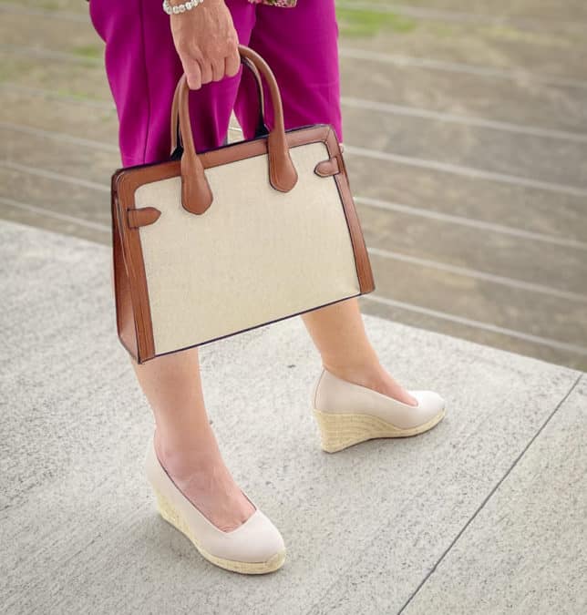 Fashion Blogger 50 Is Not Old is wearing neutral wedge espadrilles and carrying a canvas handbag