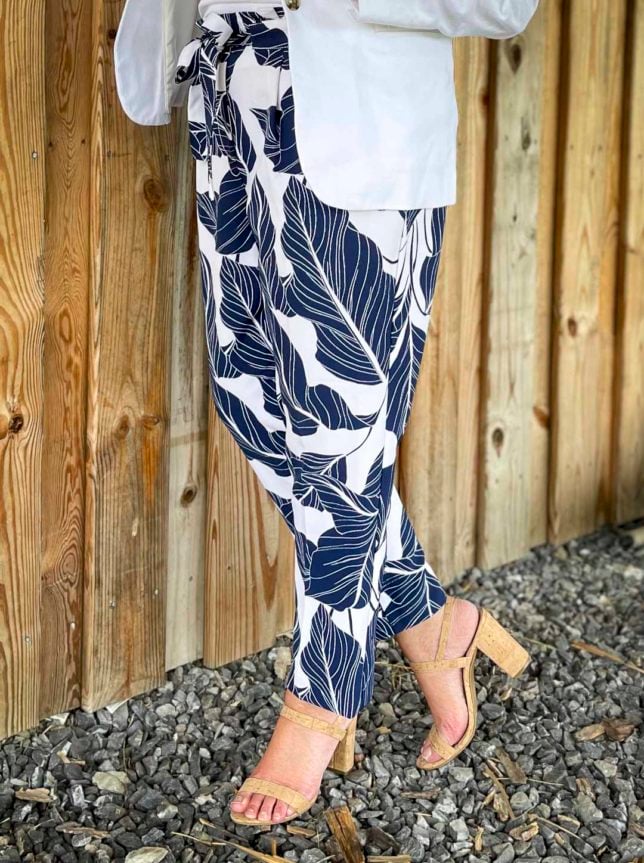 Fashion Blogger 50 Is Not Old is wearing navy and white palm print ankle pants