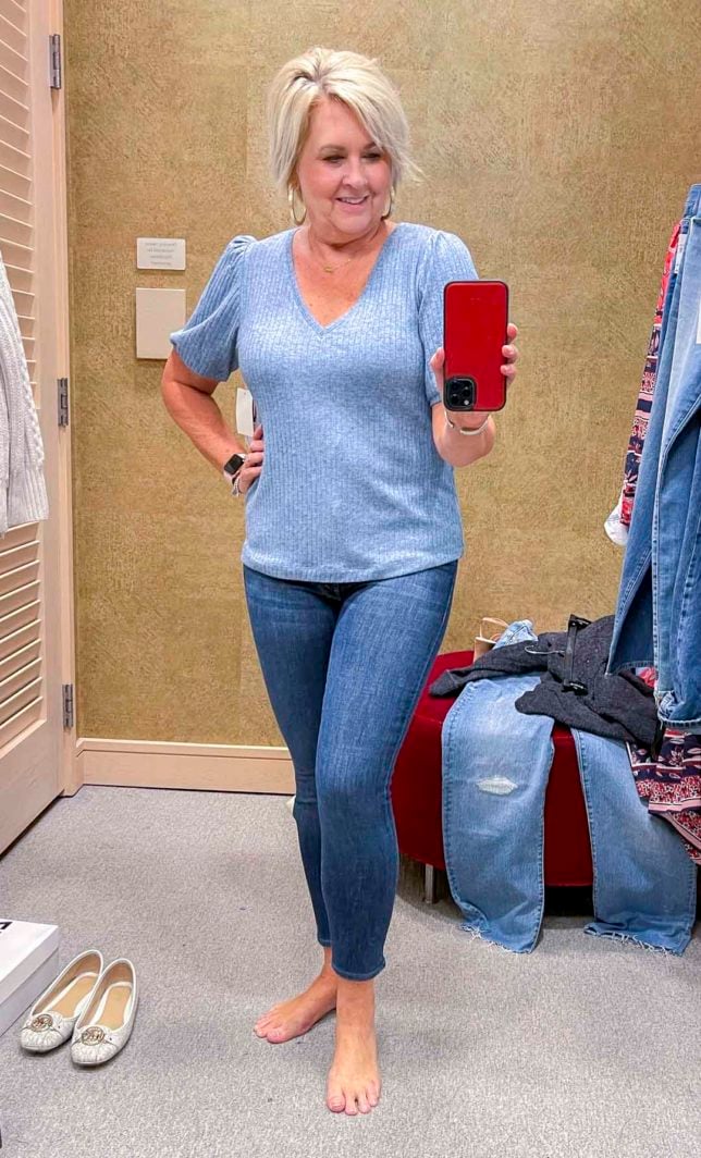 Fashion Blogger 50 Is Not Old is wearing a blue sweater with skinny jeans from the Nordstrom Anniversary Sale