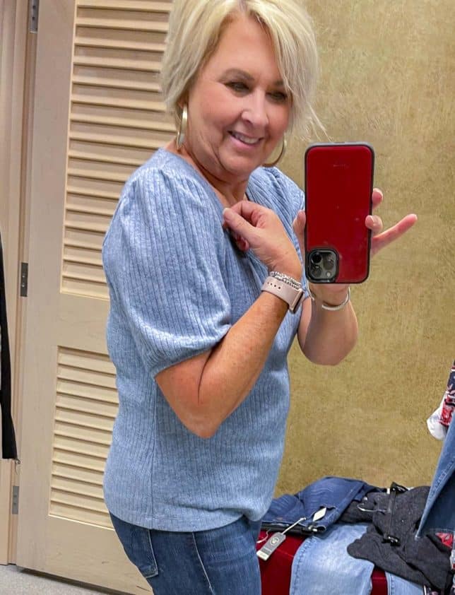 Fashion Blogger 50 Is Not Old is wearing a blue puff sleeve sweater from the Nordstrom Anniversary Sale