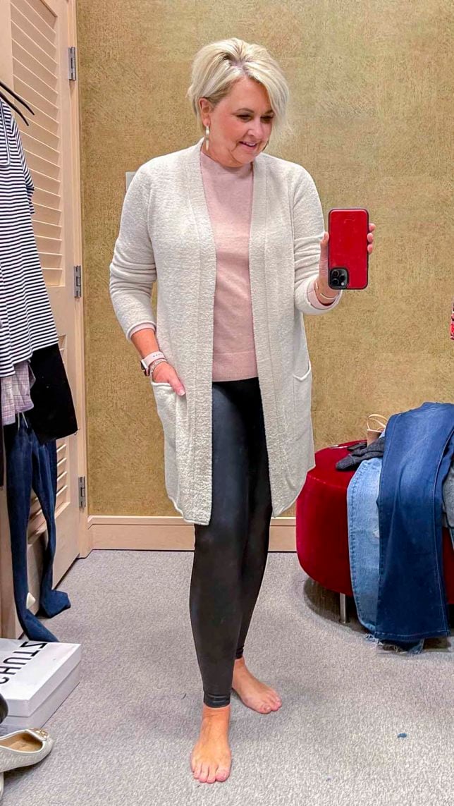 Fashion Blogger 50 Is Not Old is wearing a ivory cardigan, a pink cashmere and wool sweater, and Spanx faux leather leggings from the Nordstrom Anniversary Sale