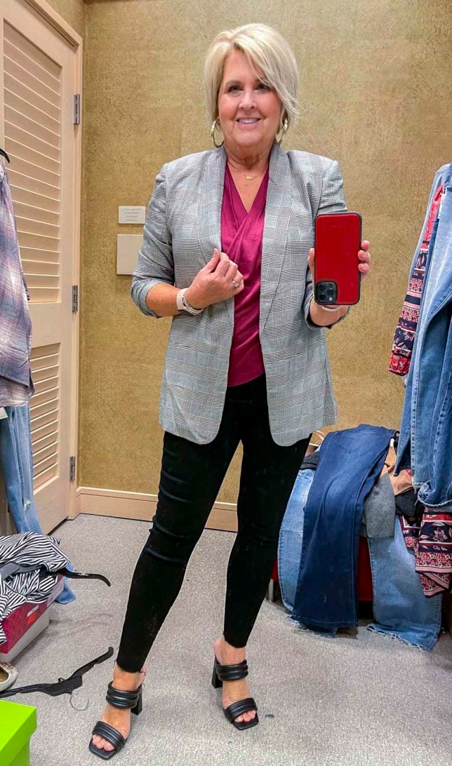 Fashion Blogger 50 Is Not Old is wearing a black check blazer, a deep pink blouse, and Spanx faux leather leggings and black heels from the Nordstrom Anniversary Sale