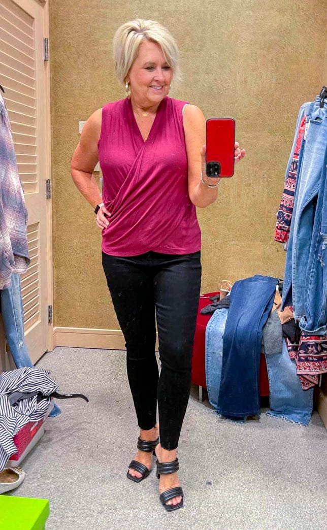 Fashion Blogger 50 Is Not Old is wearing a deep pink blouse with Spanx faux leather leggings and black heels from the Nordstrom Anniversary Sale