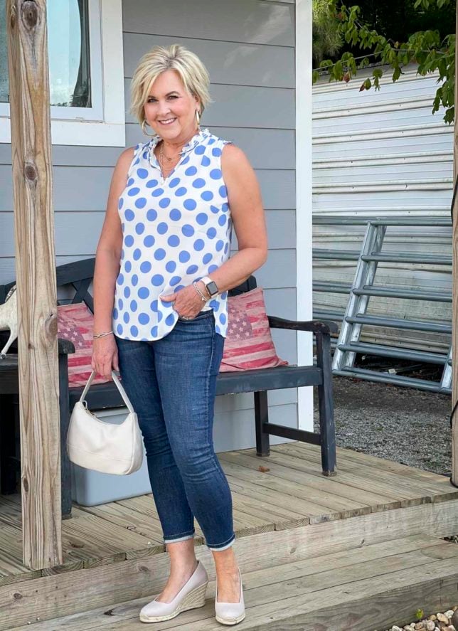Fashion Blogger 50 Is Not Old is at Foxberry Farms wearing a white and blue polka dot top with skinny jeans and espadrille shoes