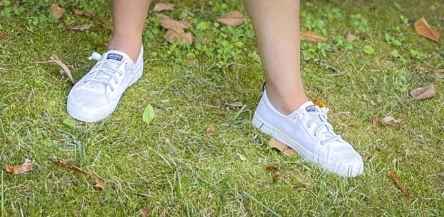Fashion Blogger 50 Is Not Old is wearing white Sperry sneakers