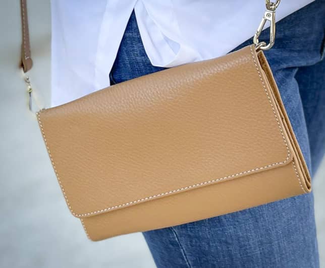 Over 40 Fashion Blogger, Tania Stephens, is showing a camel crossbody handbag/wallet