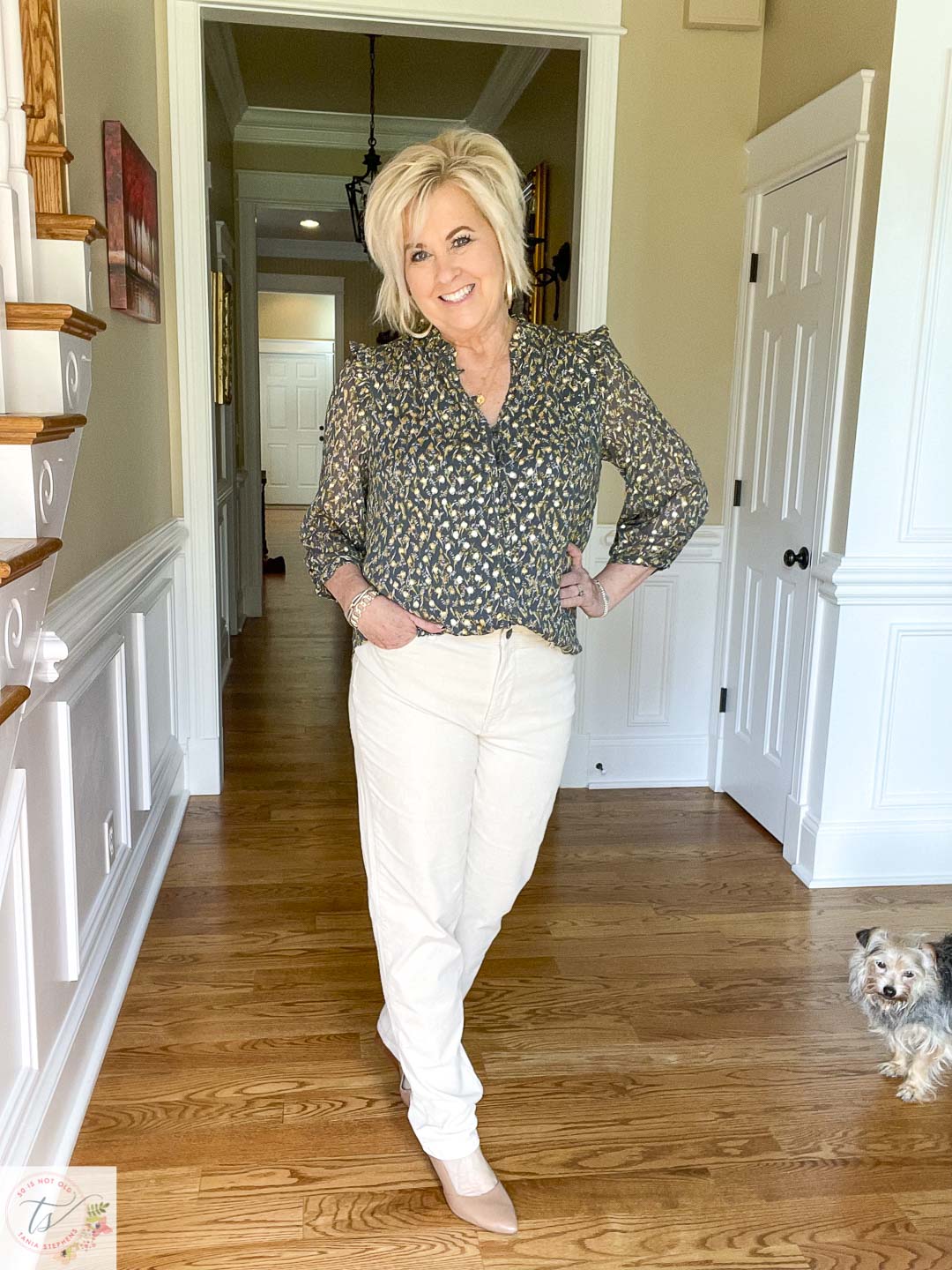 Over 40 fashion blogger, Tania Stephens, is wearing winter white corduroy pants with a dark green top