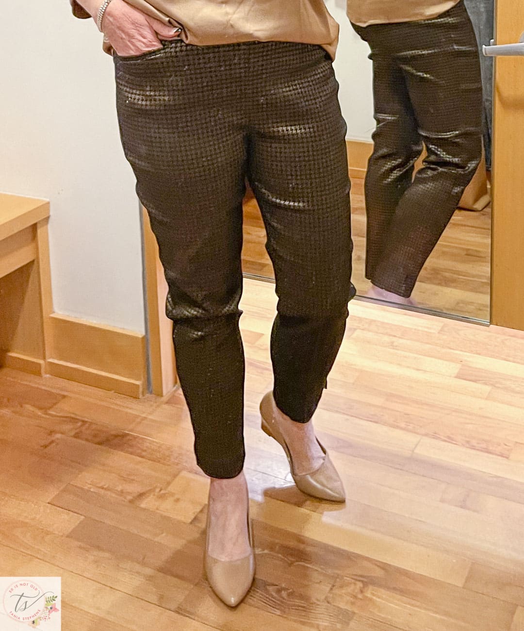 Over 40 Fashion Blogger, Tania Stephens, is trying on a Chico's black and camel foiled ankle pants