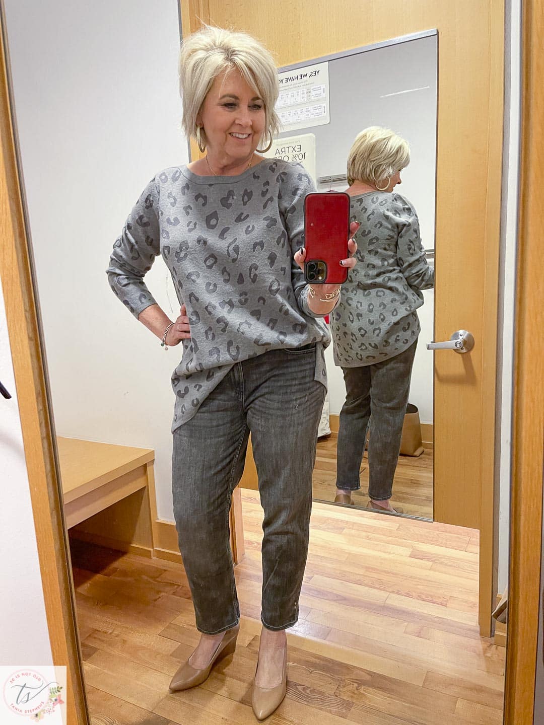 Over 40 Fashion Blogger, Tania Stephens, is trying on a Chico's animal print tunic and gray washed ankle pants